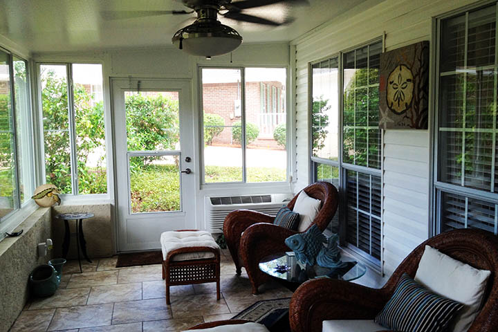 Sunroom in Fairhope, Alabama, extends the house and protects from the southern weather while creating a space for recreation and relaxing