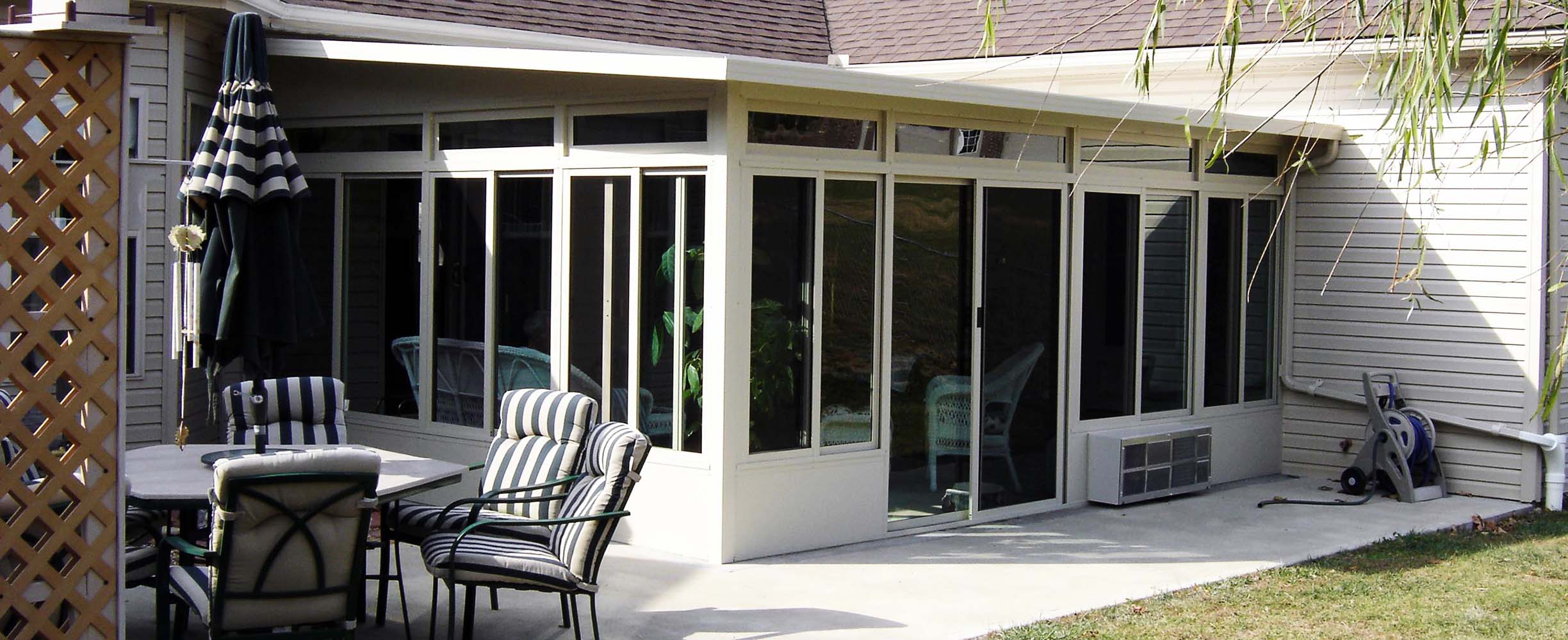 Sunroom designed and implemented for all seasons effectively expanding the house in a practical and cofortable way!