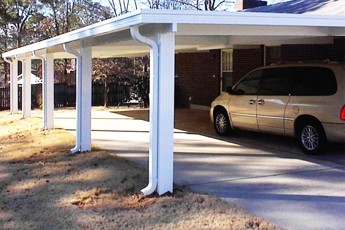 Custom carport protecting vehicles at a Mobile, Alabama residence