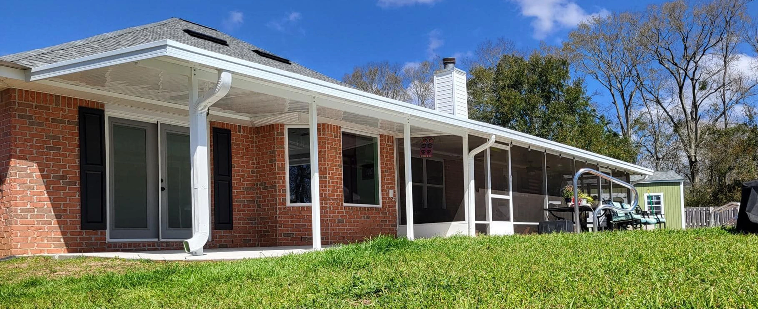 Custom patio cover adding shade and shelter to a South Alabama outdoor living space