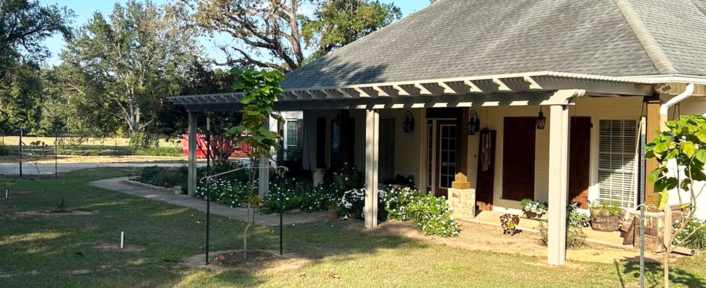 Custom pergola and trellis defining a South Alabama patio and garden