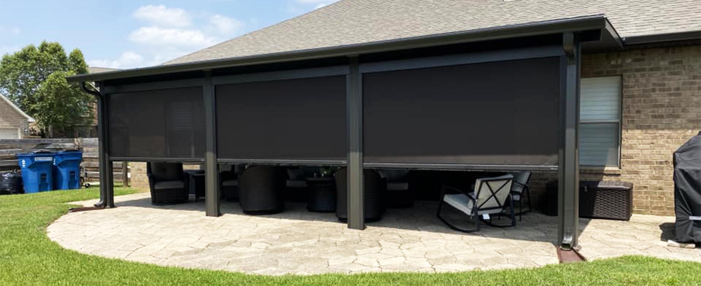 Motorized retractable rolling screens enclosing a South Alabama covered patio