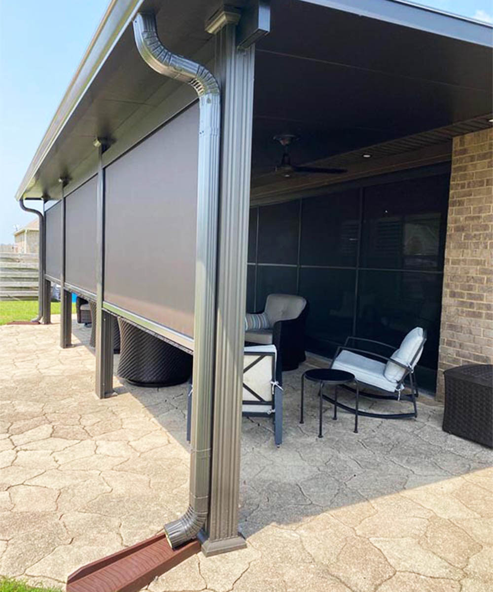 Motorized retractable screens installed on a covered outdoor living area in Alabama
