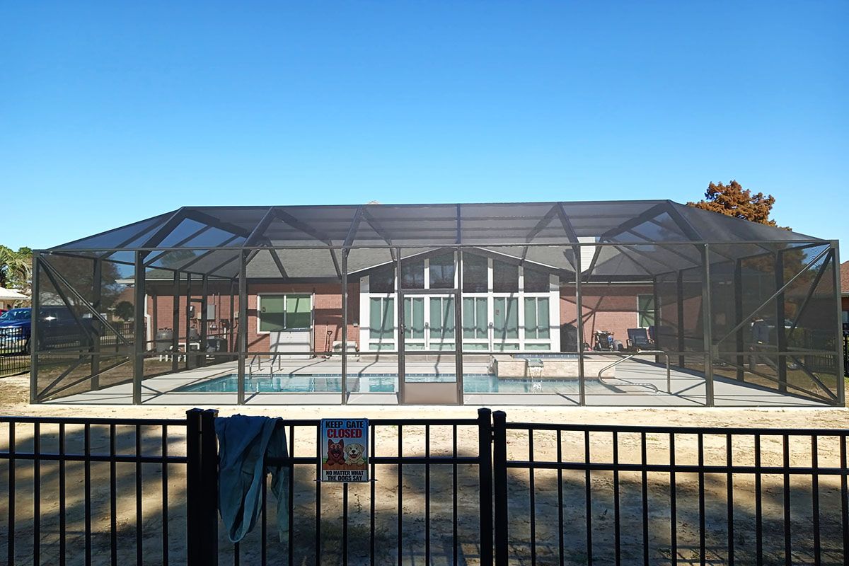 Storm-grade aluminum pool enclosure built for Gulf Coast conditions in Southern Alabama