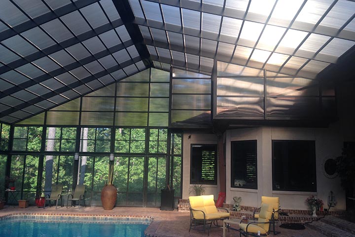 Lexan polycarbonate roof over a custom enclosed swimming pool in South Alabama