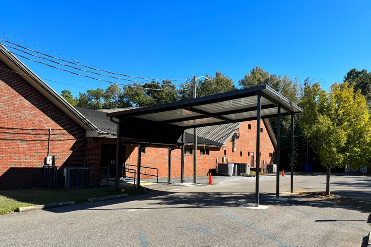 Custom patio cover providing sheltered outdoor space at a South Alabama church