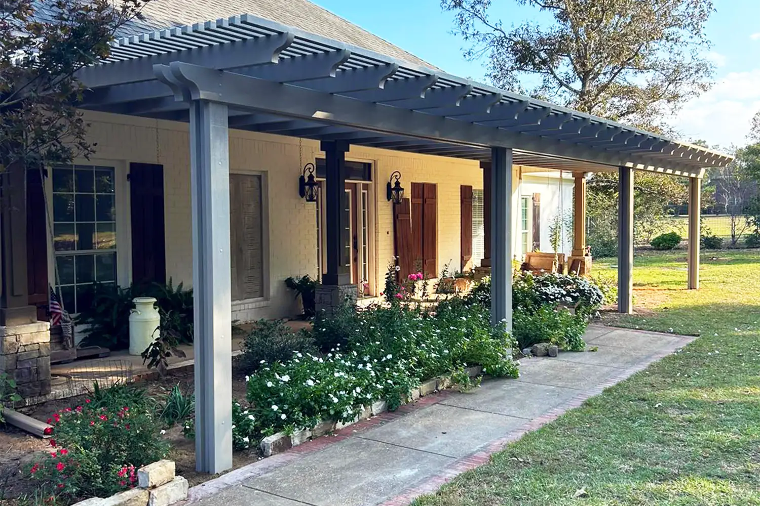 Custom pergola defining an outdoor living area at a South Alabama home