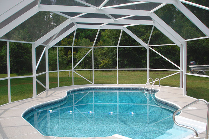 Custom dark-frame pool enclosure surrounding a residential swimming pool in Baldwin County, Alabama