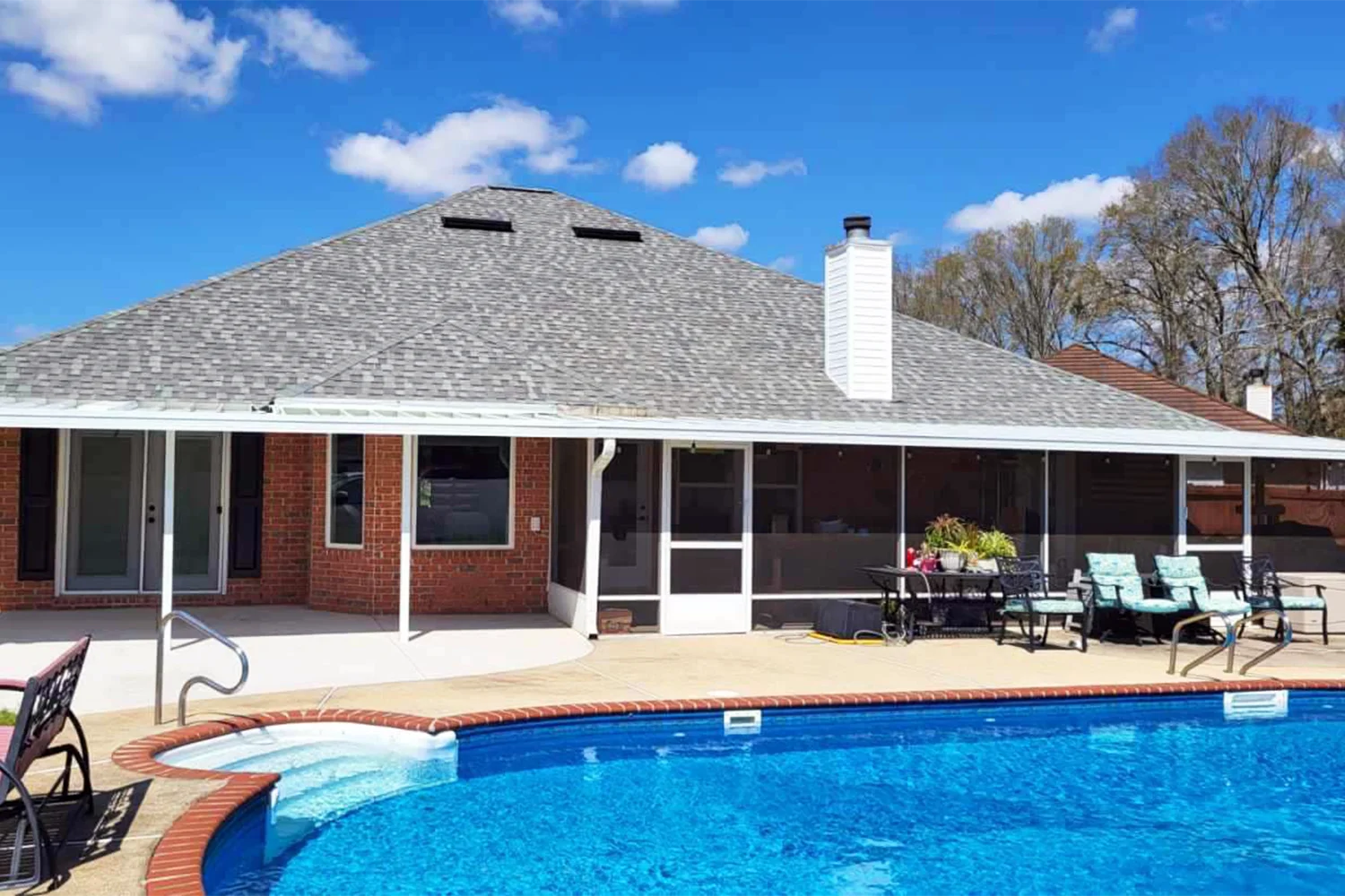 Custom screen room creating protected outdoor living space at a South Alabama home