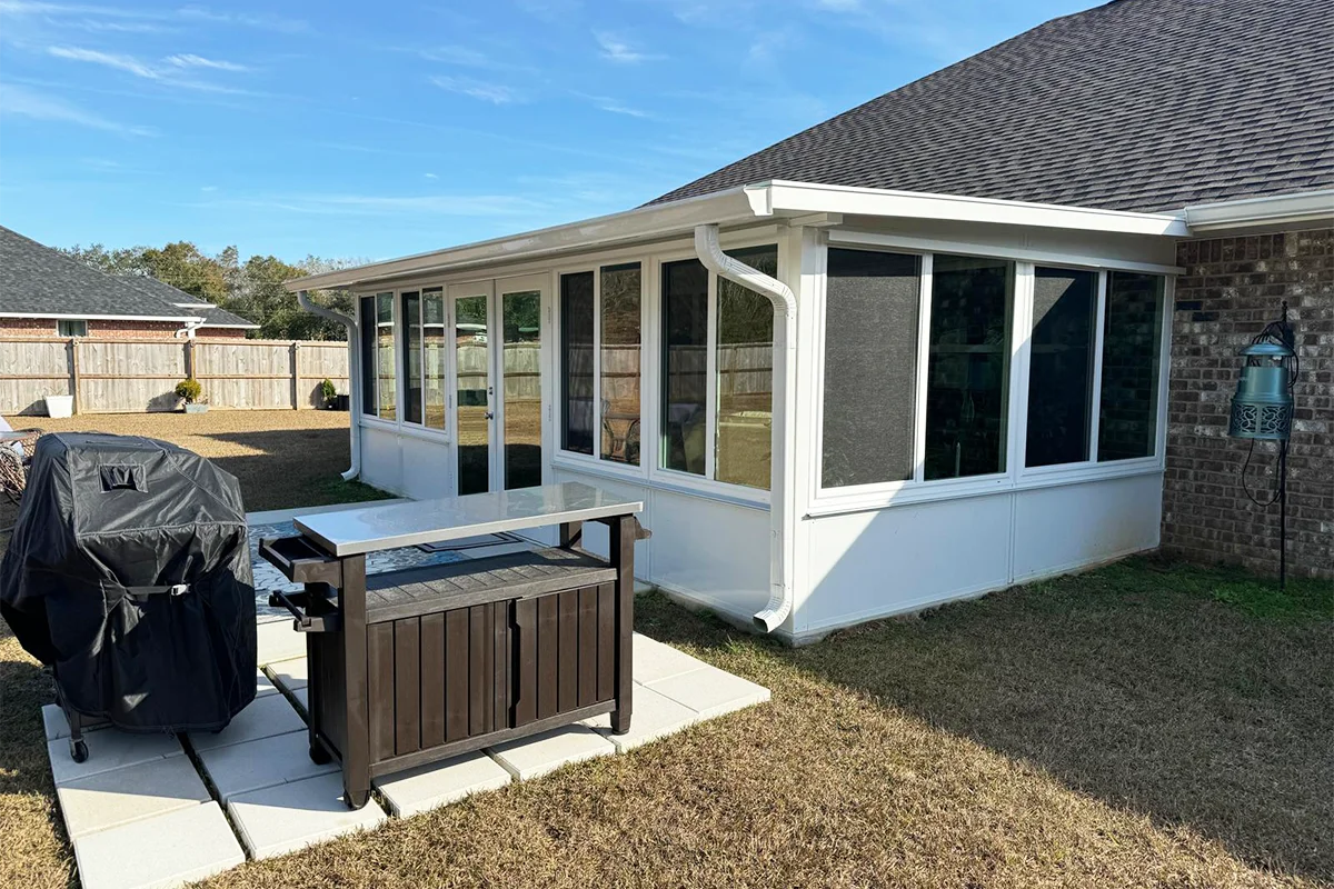 Custom sunroom addition connected to an existing South Alabama residence